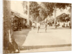 Street scene in the Dutch East Indies with passersby and shops by Anonymous