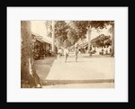 Street scene in the Dutch East Indies with passersby and shops by Anonymous