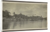 Bank of a village with derricks and buildings seen from the water by Anonymous