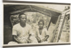 Two Indian boys sitting in roofed wooden boat by Anonymous