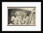 Two Indian boys sitting in roofed wooden boat by Anonymous