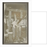 Man operating a machine with a lever by Anonymous