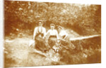 Three women sitting in a forest near a path by Anonymous