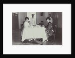 Group portrait of young women at the table with servants in the Dutch East Indies, indonesia by Anonymous