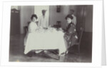 Group portrait of young women at the table with servants in the Dutch East Indies, indonesia by Anonymous