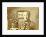 Portrait of an old lady with glasses in a living room by Anonymous