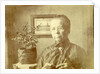 Portrait of an old lady with glasses in a living room by Anonymous