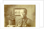 Portrait of an old lady with glasses in a living room by Anonymous