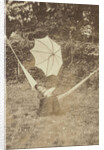 Portrait of a woman in a hammock with a parasol by Anonymous