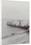 Group men in a boat on the beach in the Dutch East Indies, indonesia by Anonymous