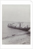 Group men in a boat on the beach in the Dutch East Indies, indonesia by Anonymous
