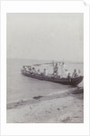 Group men in a boat on the beach in the Dutch East Indies, indonesia by Anonymous