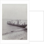 Group men in a boat on the beach in the Dutch East Indies, indonesia by Anonymous