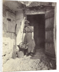 Portrait of a young woman in a doorway by Anonymous
