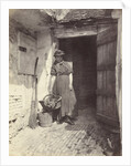 Portrait of a young woman in a doorway by Anonymous