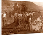 Spanish laborers at work in Culebra Cut and loaded train hauling dirt from canal, USA by Anonymous