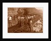 Spanish laborers at work in Culebra Cut and loaded train hauling dirt from canal, USA by Anonymous