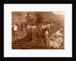 Spanish laborers at work in Culebra Cut and loaded train hauling dirt from canal, USA by Anonymous