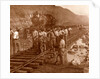 Spanish laborers at work in Culebra Cut and loaded train hauling dirt from canal, USA by Anonymous