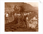 Spanish laborers at work in Culebra Cut and loaded train hauling dirt from canal, USA by Anonymous