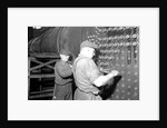 Eddystone, Pennsylvania - Railroad parts. Boilermaker and helper working on locomotive boiler, 1936 by Lewis Hine