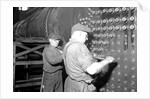 Eddystone, Pennsylvania - Railroad parts. Boilermaker and helper working on locomotive boiler, 1936 by Lewis Hine