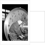 Eddystone, Pennsylvania - Railroad parts. Machinist finishing axle on large driving wheels on newest type of locomotive, March 1937 by Lewis Hine