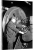 Eddystone, Pennsylvania - Railroad parts. Machinist machining wheel to fit driving pin on above wheels on newest type of locomotive, March 1937 by Lewis Hine