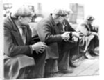 Row of men at the New York City docks out of work during the depression, 1934 by Lewis Hine