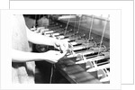 Paterson, New Jersey - Textiles. Quiller tying the broken ends of thread being wound on to quills, March 1937 by Lewis Hine