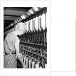 Millville, New Jersey - Textiles. Millville Manufacturing Co. Lady twisting thread, 1936 by Lewis Hine