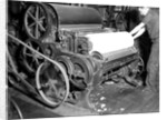 Millville, New Jersey - Textiles. Millville Manufacturing Co. Man rolling fabric, 1936 by Lewis Hine