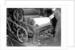 Millville, New Jersey - Textiles. Millville Manufacturing Co. Man rolling fabric, 1936 by Lewis Hine