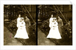 A western Red Cross female doctor(?) and two Japanese women posed in a garden by Anonymous
