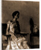 Lady sitting on chair next to parrot by Thomas Wilmer Dewing