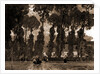 Women with umbrellas walking and trees in background by Sir Alfred East