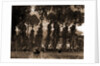 Women with umbrellas walking and trees in background by Sir Alfred East