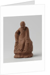 Man figure with raised right leg on rocky pedestal. Red stoneware. by Anonymous