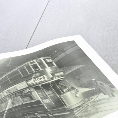 Transport workers washing a tram at the Holloway Car Shed, London, 1932 by Unknown