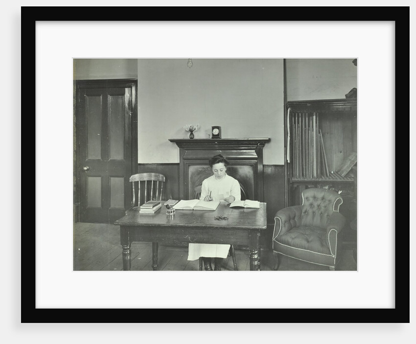 Female student sitting at desk, Shoreditch Technical Institute, London, 1907 by Unknown