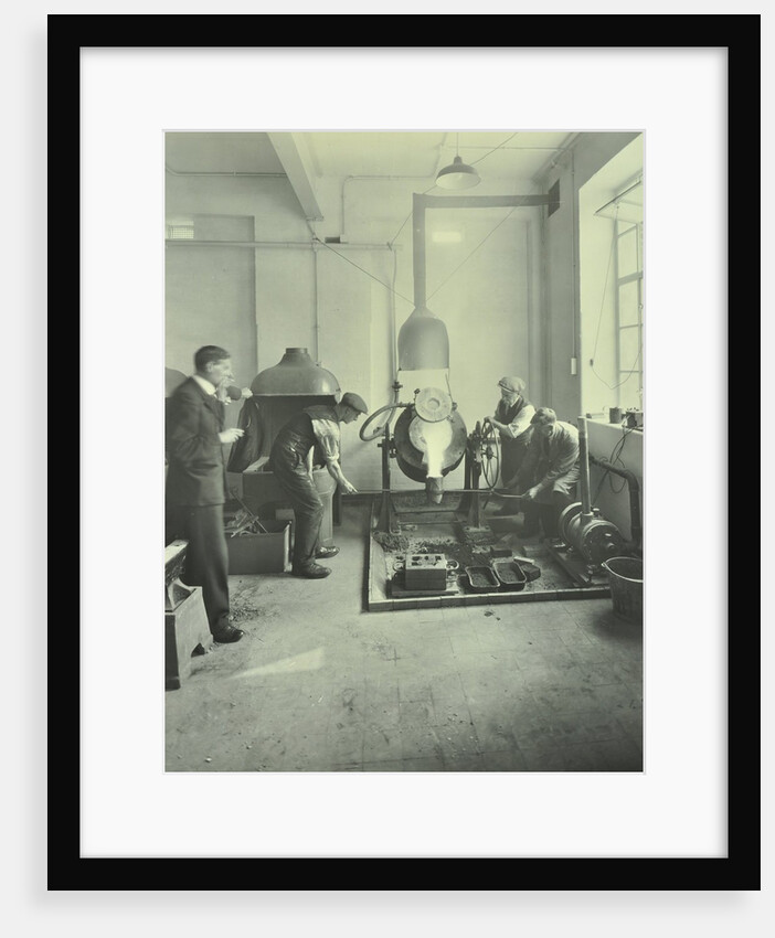 Men pouring molten metal in a foundry, School of Engineering and Navigation, London, 1931 by Unknown