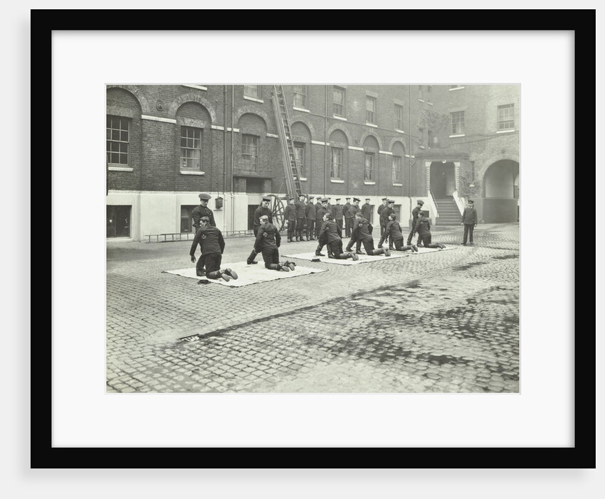 Demonstrating how to pick up an unconscious person, London Fire Brigade Headquarters, London, 1910 by Unknown