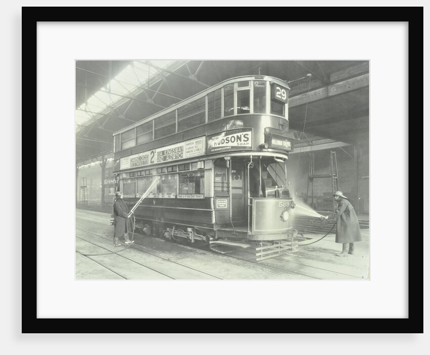 Transport workers washing a tram at the Holloway Car Shed, London, 1932 by Unknown