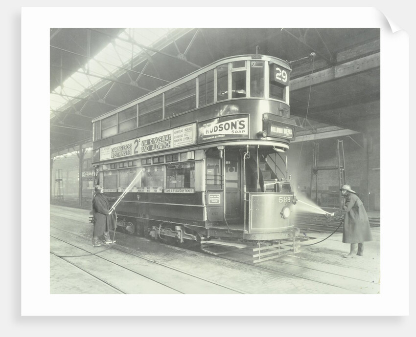 Transport workers washing a tram at the Holloway Car Shed, London, 1932 by Unknown