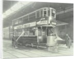 Transport workers washing a tram at the Holloway Car Shed, London, 1932 by Unknown