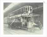 Transport workers washing a tram at the Holloway Car Shed, London, 1932 by Unknown