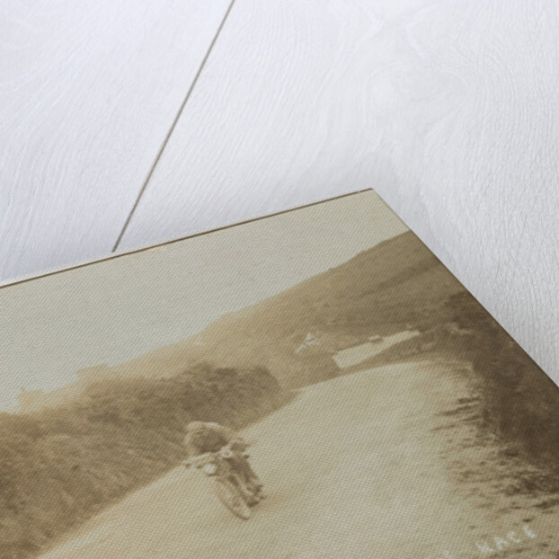 Rider passing along Kirk Michael to Peel coast road, captioned ‘C.R.Collier, winner of the motorcycle race’, likely to be 1907 TT (Tourist Trophy) by Anonymous