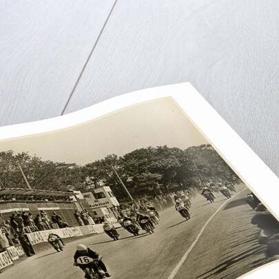 Competitors leaving the start line during the mass start of the 1958 250cc TT (Tourist Trophy) by T.M. Badger