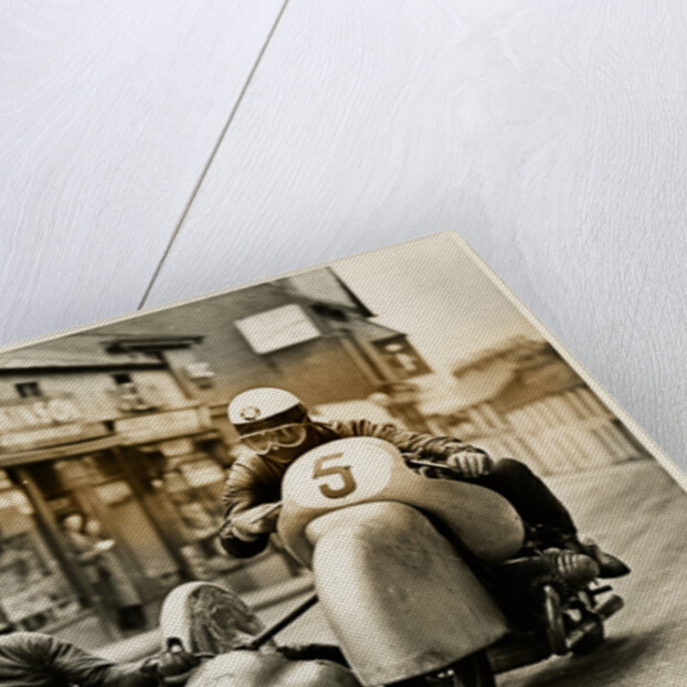 BMW sidecar outfit (number 5) passing through Onchan village by T.M. Badger