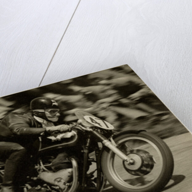 TT (Tourist Trophy) rider Cook from New Zealand aboard Moto Guzzi (number 47) by T.M. Badger